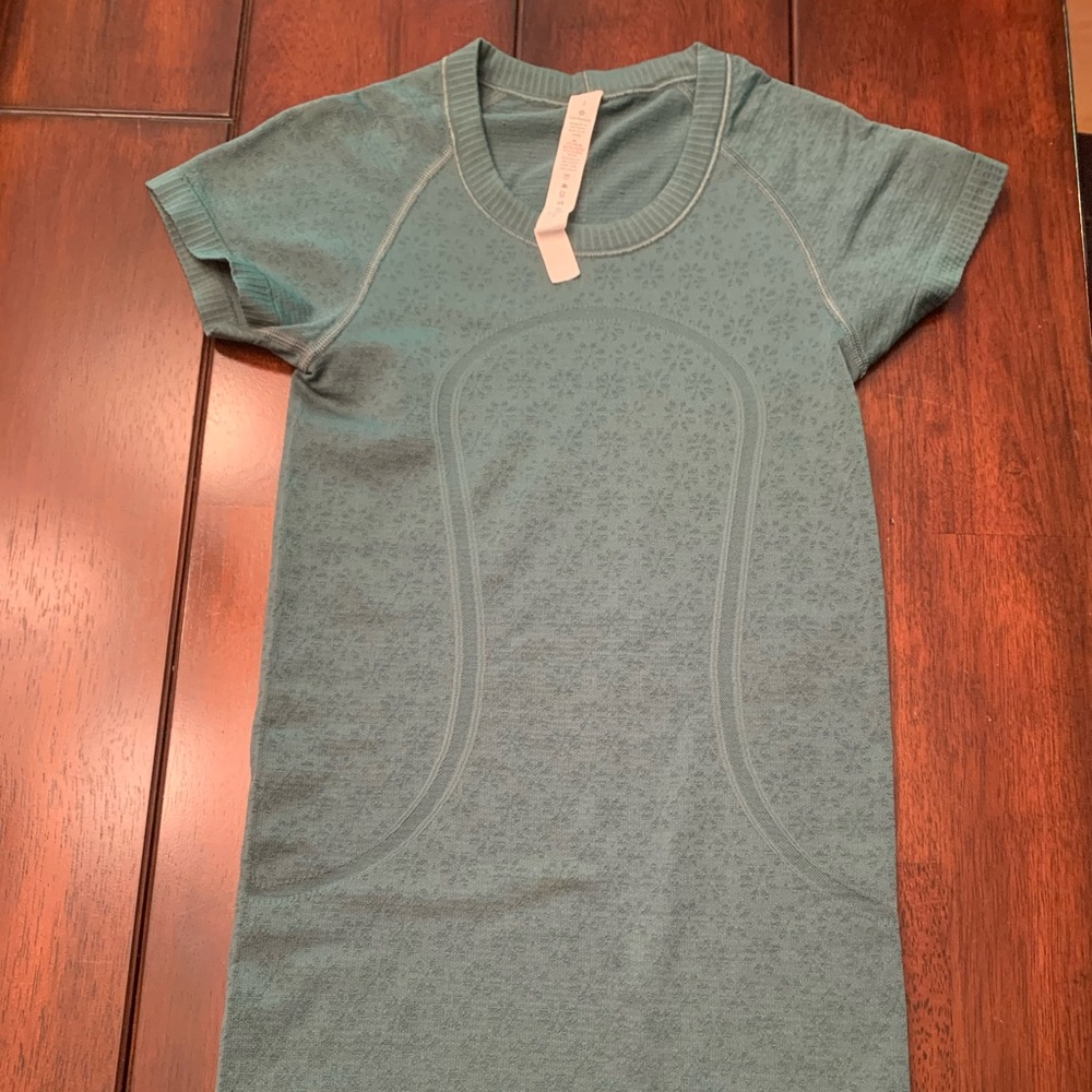 Green lululemon swiftly tech short sleeve. Size 2
